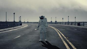 astronaut walks in the middle of a road video