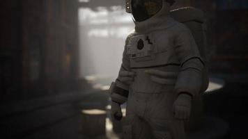 Lost Astronaut near Abandoned Industrial Buildings of Old Factory video