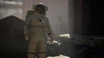 Lost Astronaut near Abandoned Industrial Buildings of Old Factory video