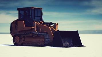 road grading machine on the salt desert road video