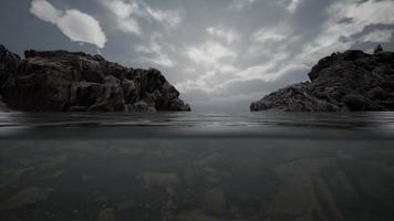 Half underwater in northern sea with rocks video