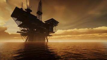 Offshore Jack Up Rig in The Middle of The Sea at Sunset Time video