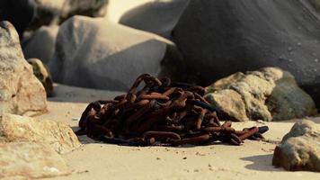 old rusted chain in the sand