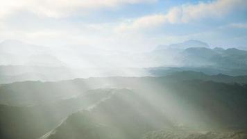 aerial vulcanic desert landscape with rays of light video