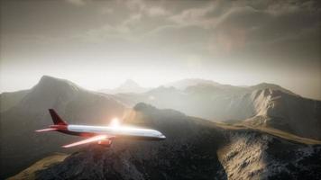 Passenger aircraft over mountain landscape video