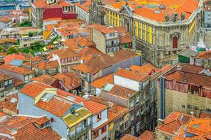 Aerial panoramic view of Porto Oporto city historical centre with red tiled roof typical buildings photo