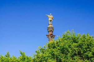 Columbus Monument to Christopher Columbus at lower end of La Rambla on embankment near port of Barcelona photo