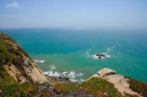 Cape Roca, cliff above the Atlantic ocean, azure water in the Atlantica photo