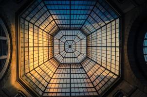 Glass and iron patterned ceiling roof of huge dome view from below photo