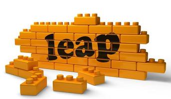 leap word on yellow brick wall photo