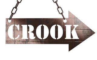 crook word on metal pointer photo