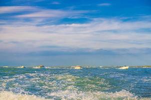 Yacht boats racing sailing on water of Venetian lagoon photo