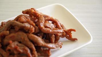 Sun-Dried Pork on white plate - Asian food style