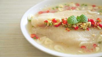 Steamed Fish in Spicy Lemon Sauce on white plate video