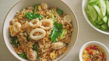 Fried rice with squid or octopus in bowl - stir-fried rice with squid, egg and kale video