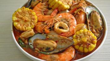 spicy barbecue seafood - shrimps, sqiud, mussel and corn video