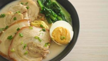 Ramen noodles in pork bone soup with roast pork and egg or Tonkotsu ramen noodles - Japanese food style video