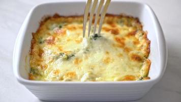 baked spinach lasagna with cheese in white plate video