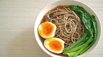 ramen noodles with egg and vegetable - vegan or vegetarian food style