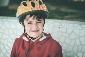 smiling Child with bicycle helmet photo