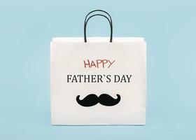 happy Father's Day. White shopping bag with false mustache and the word Happy Father's day photo