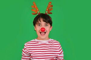 Merry Christmas.Funny kid in a Rudolph reindeer christmas costume photo