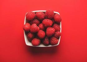 closeup of raspberries in a bowl