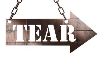 tear word on metal pointer photo