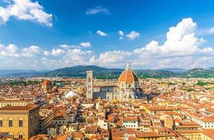 Top aerial panoramic view of Florence city with Duomo Cattedrale di Santa Maria del Fiore cathedral photo