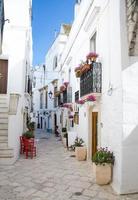 Narrow white streets of Locorotondo in Puglia photo
