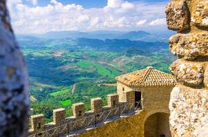 Aerial top panoramic view landscape with valley, green hills, fields, villages of Republic San Marino photo