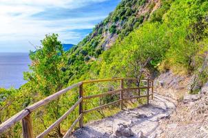 Pedestrian hiking stone path trail with railing between Corniglia and Vernazza villages