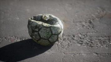 Old soccer ball the cement floor video