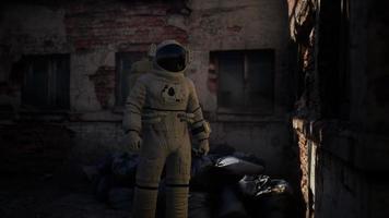 Lost Astronaut near Abandoned Industrial Buildings of Old Factory video