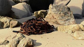 old rusted chain in the sand