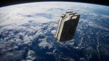 metal vintage and dirty jerrycan on Earth orbit