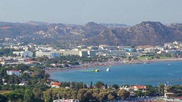 Faliraki Bay beach and mountain landscape panorama Rhodes Greece. video