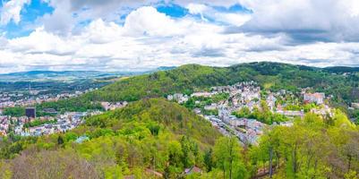 Karlovy Vary city aerial panoramic view with row of colorful multicolored buildings photo