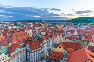 Top aerial panoramic view of Prague Old Town Stare Mesto historical city centre with red tiled roof buildings photo