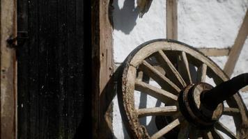 old wood wheel and black door at white house video