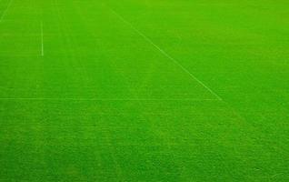 Top aerial view of football pitch soccer field with green grass lawn, pattern texture photo