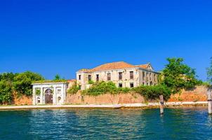 Old building and brick defense wall of Fortress Forte San Felice di Chioggia in island photo