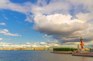 Strelka Arrow of Vasilyevsky Island with green trees and Rostral Columns photo