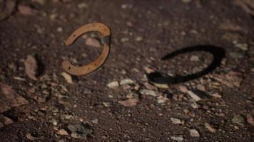 extreme slow motion old rusty metal horseshoe