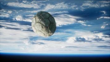 old soccer ball in space on Earth orbit video