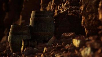 old wooden vintage wine barrels near stone wall in canyon video