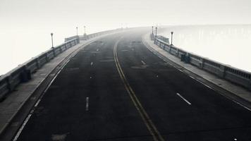 long bridge in misty fog video
