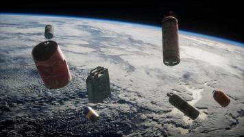 Space debris, pollution of the atmosphere of the planet Earth and space by human waste. Elements furnished by NASA video