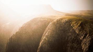 dry yellow grass on the rocky mountain with heavy fog video