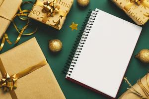 Merry Christmas. Top view of notebook with christmas gifts and christmas decorations.Christmas concept background photo